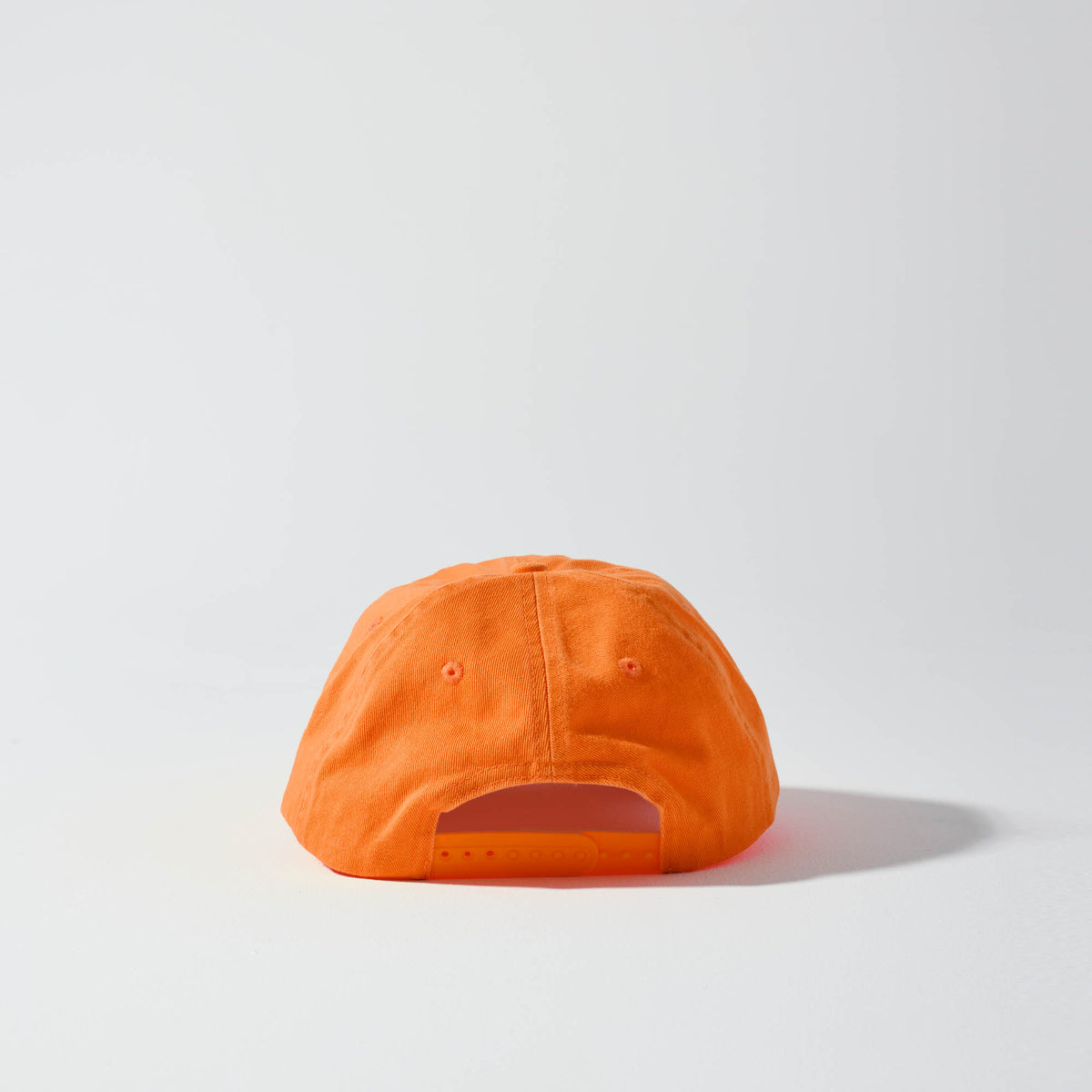 An orange coloured, 6-panel unstructured 'Dad' baseball cap made of recycled cotton twill with snap back by House of Peaks. Australian Hats