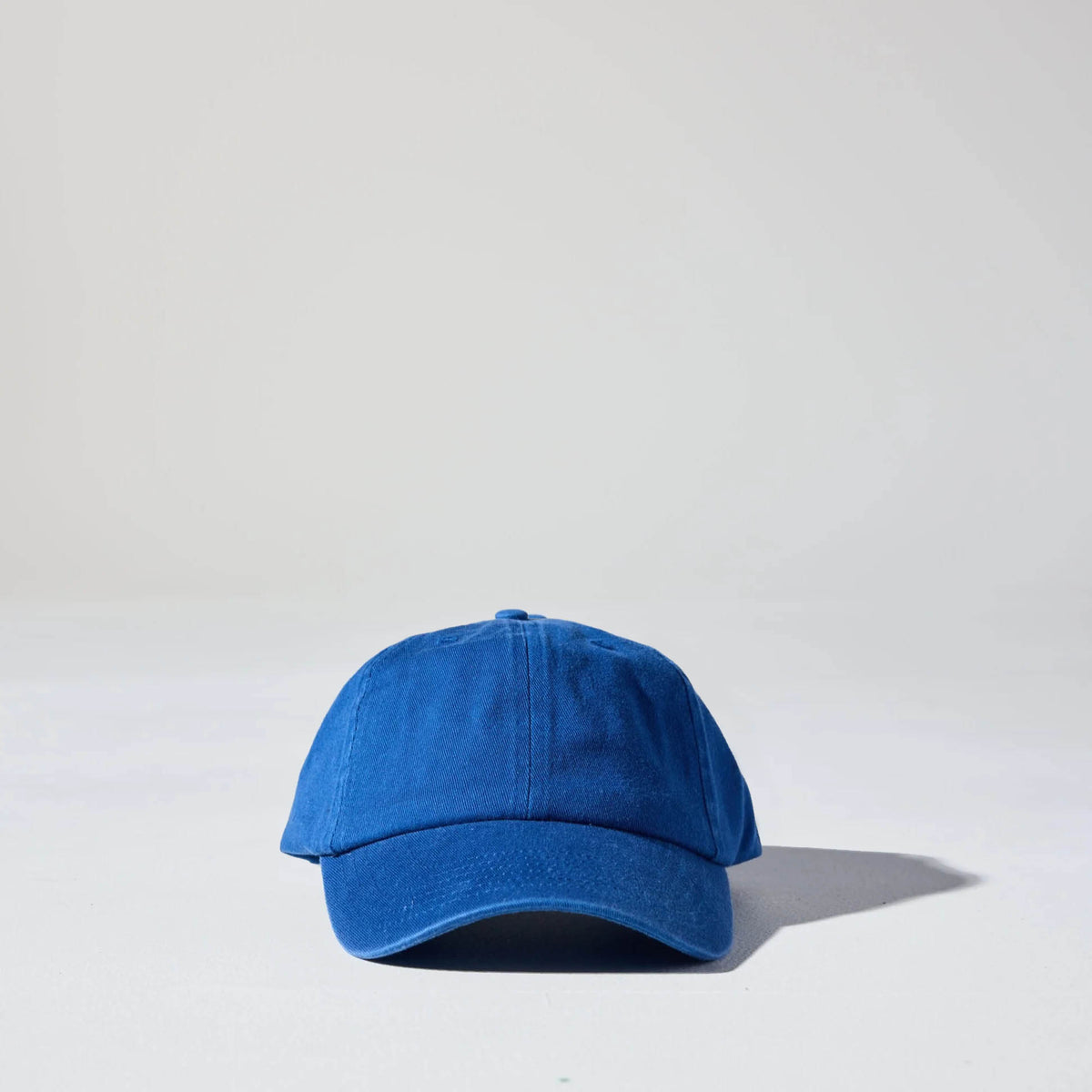 A royal blue coloured, 6-panel unstructured 'Dad' baseball cap made of recycled cotton twill with snap back by House of Peaks. Australian Hats