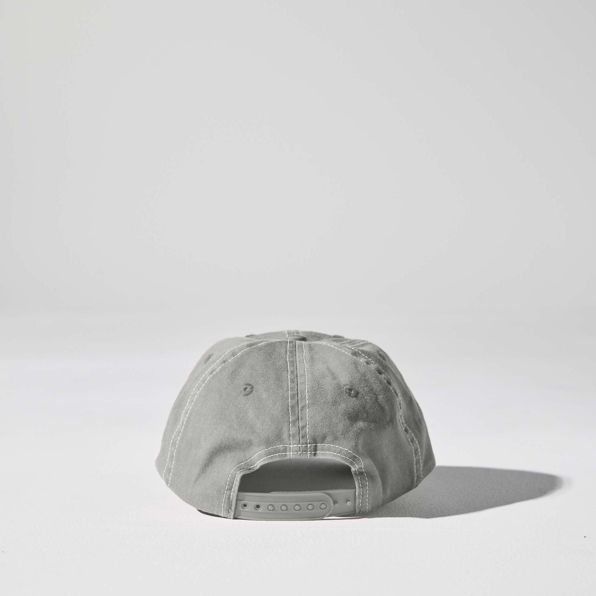 A light grey 6 panel 'Dad' cap with white contrast stitching and an adjustable plastic snapback adjustment. Best Blank Hats by House of Peaks.