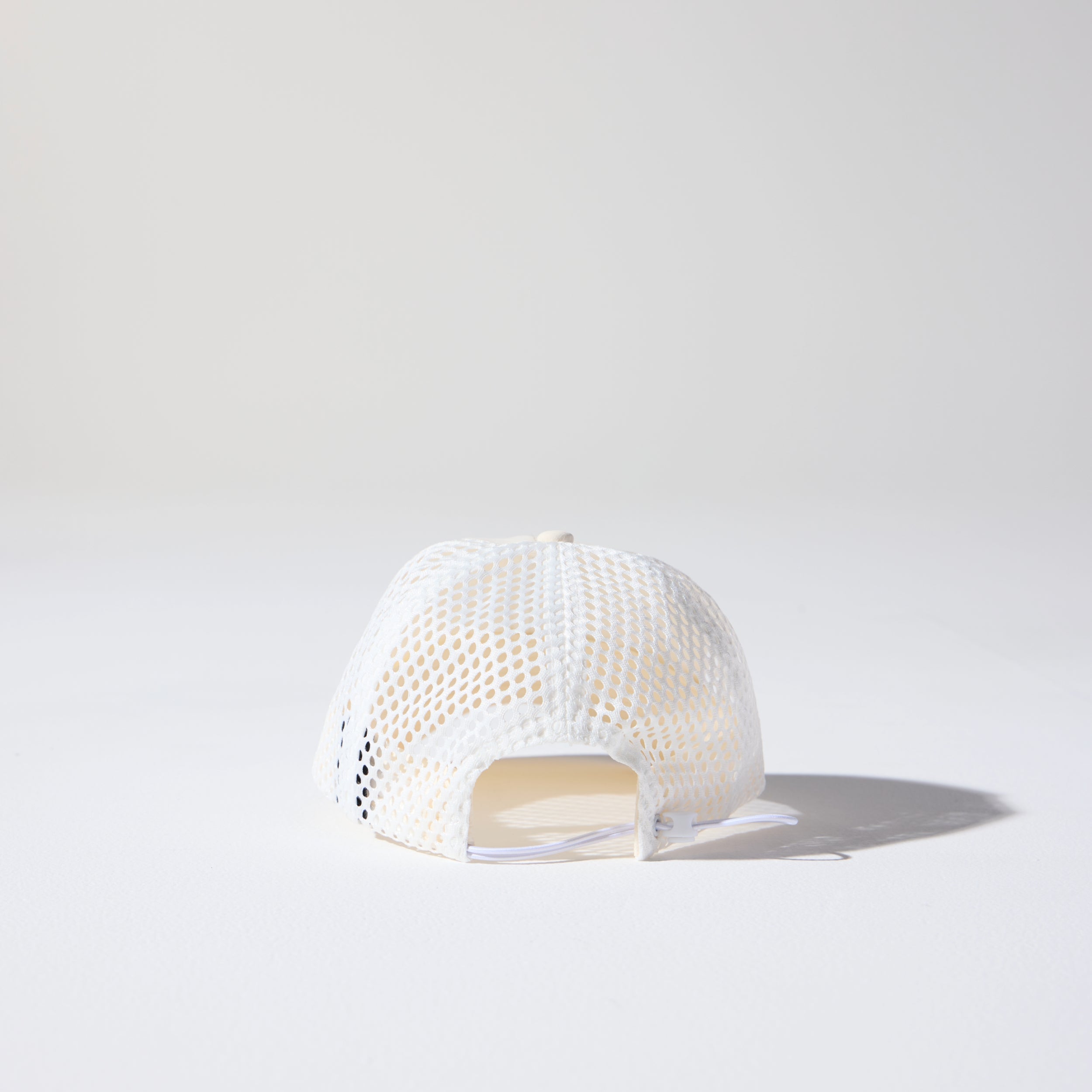 Back of Friday Mesh Cap in Cream by House of Peaks – recycled nylon running hat with breathable mesh and bungee cord.