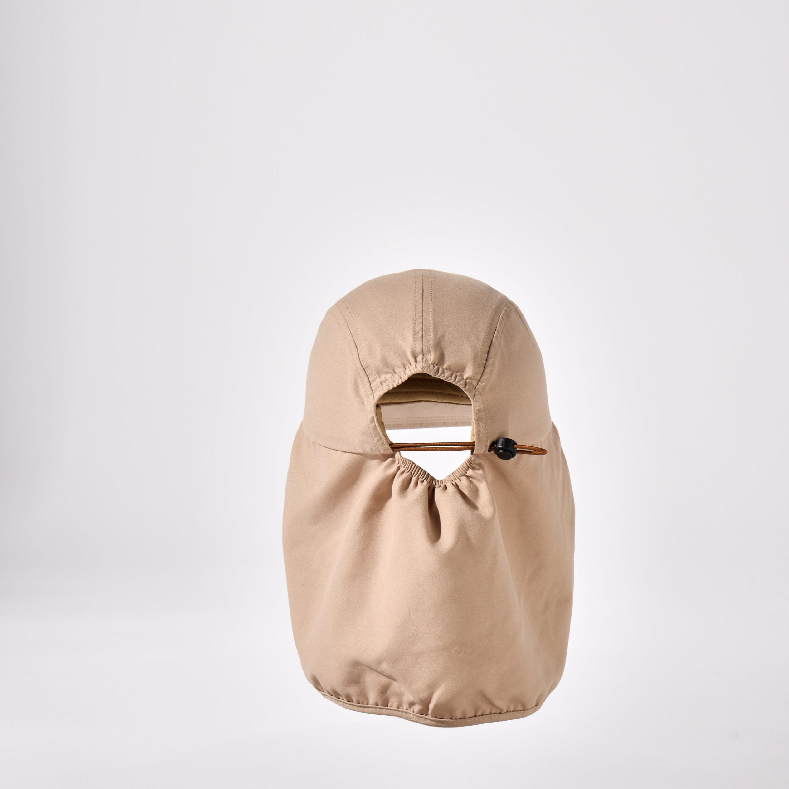 A tan, beige and brown holiday legionnaire sun protection cap by House of Peaks with neck flap and an adjustable bungee cord.