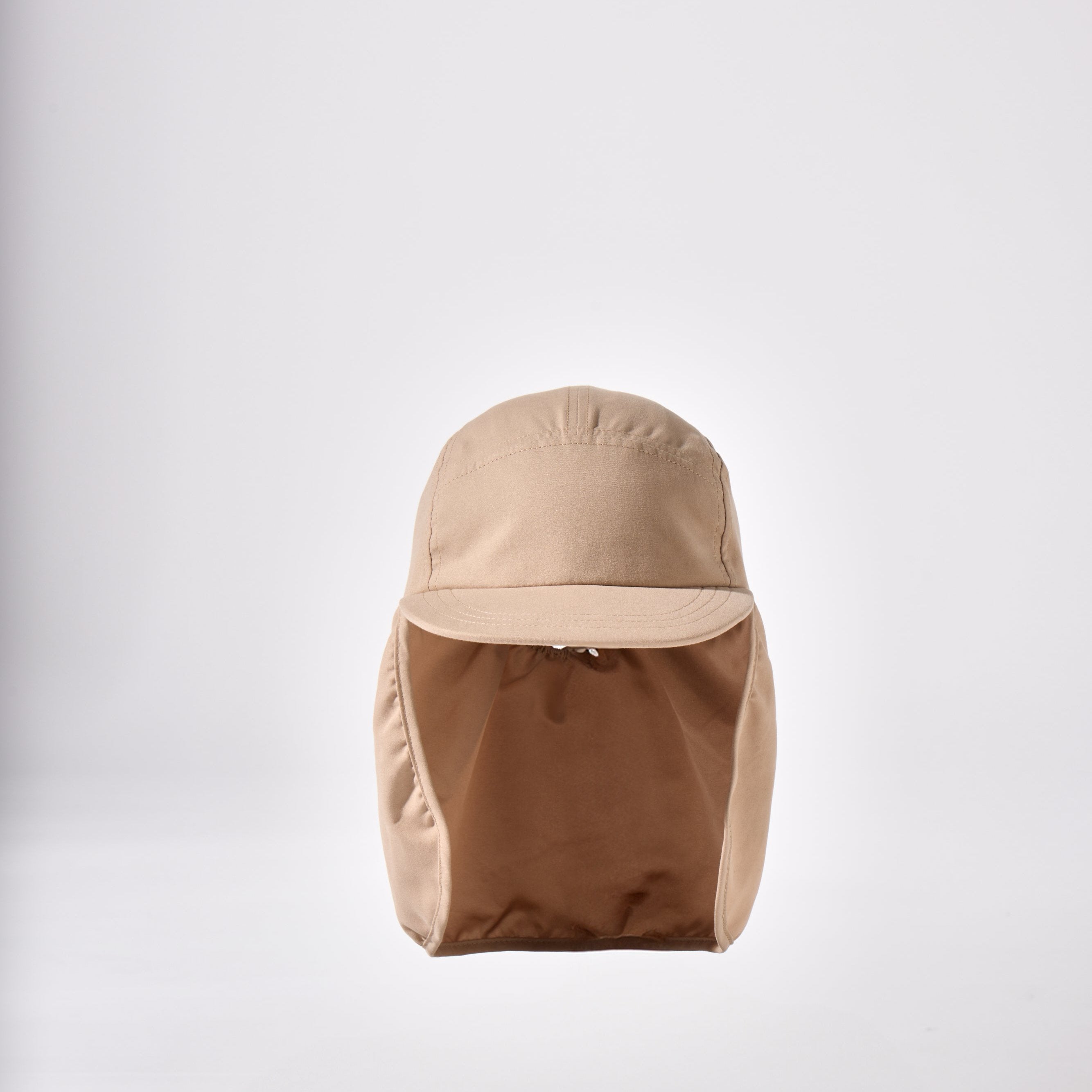 A tan, beige and brown holiday legionnaire sun protection cap by House of Peaks with neck flap and an adjustable bungee cord.
