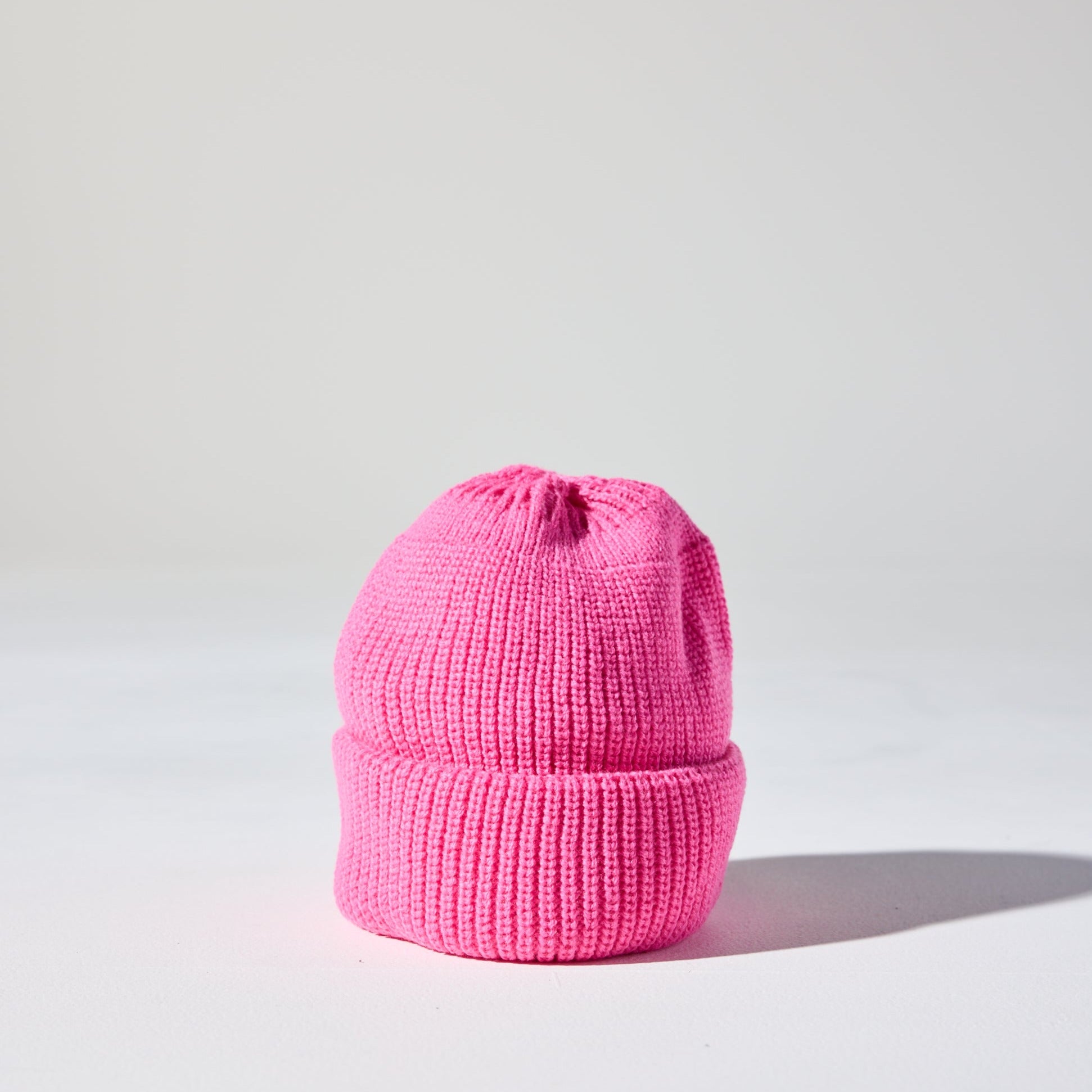 This pink Layday Beanie by House of Peaks is a thick, double-lined acrylic knit, tall profile, warm and unisex winter hat.