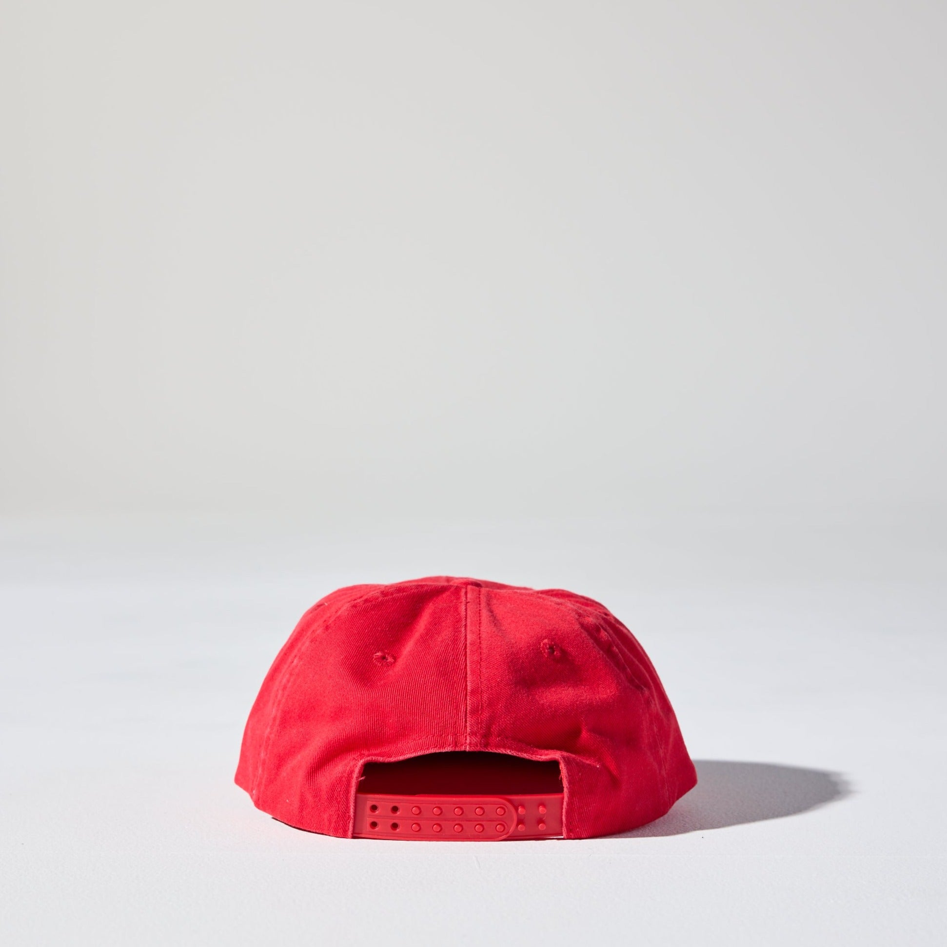 A red retro vibe 6 panel snapback cap made of recycled cotton twill. This vintage-style Monday Snap Cap by House of Peaks has a soft unstructured peak.