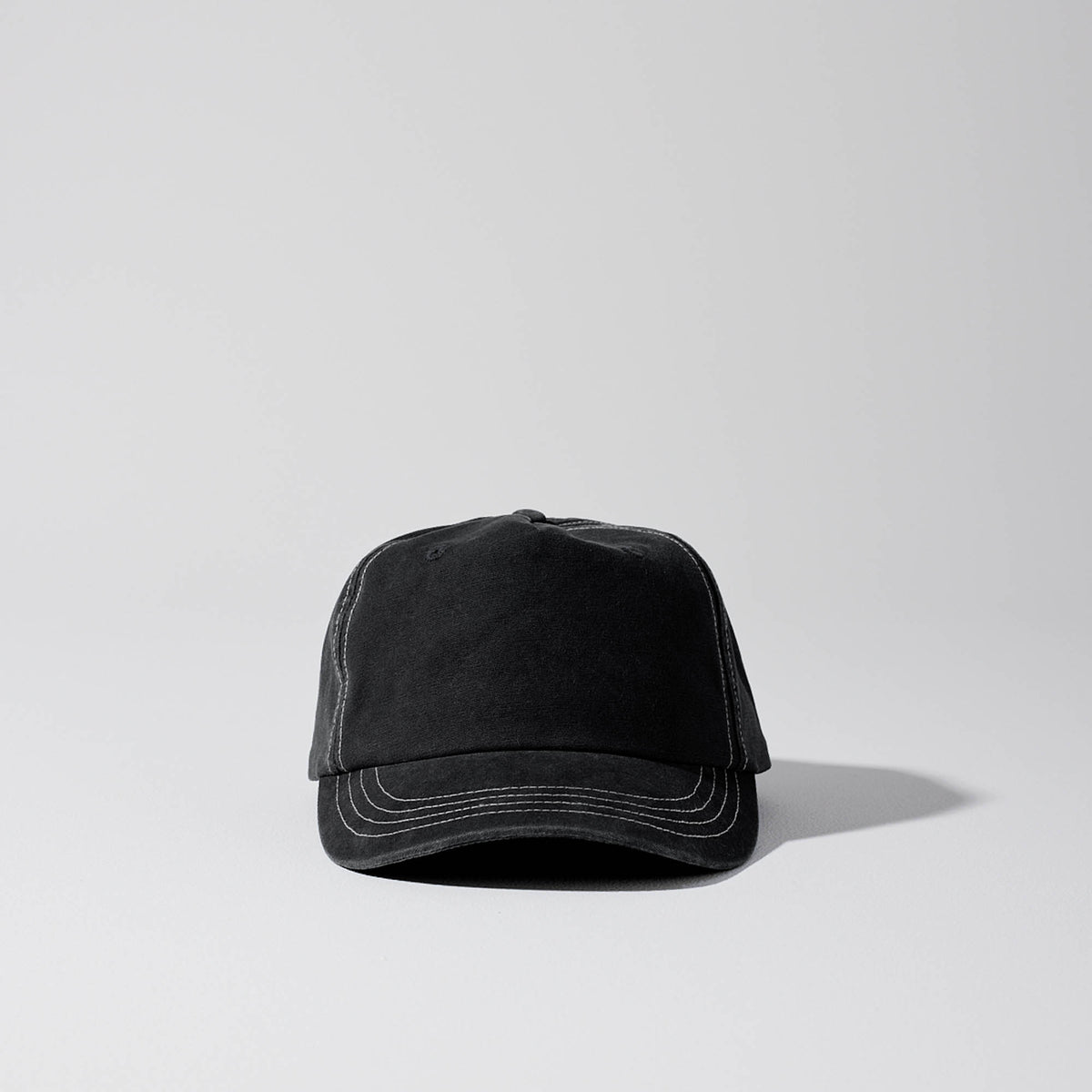 Short Peak Full Curve 5 panel cap. Structured Curved Peak. Black with contrast white stitching. Baseball cap. Australian hats. 